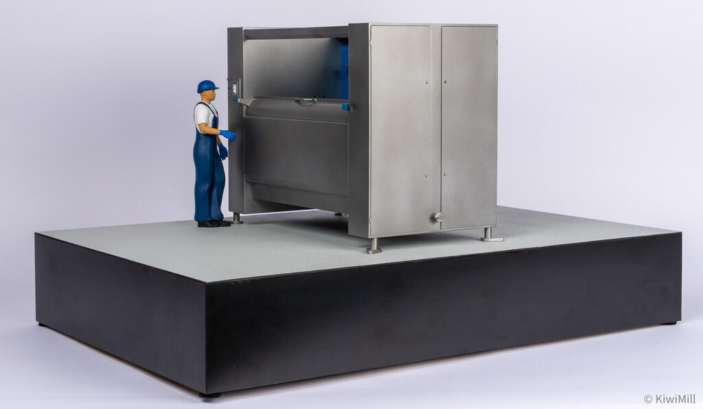 Low side angle of the chiller model's end panel with double doors, base fitting, and operator at the front corner